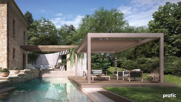 A retractable pergola next to a swimming pool in a holiday house.